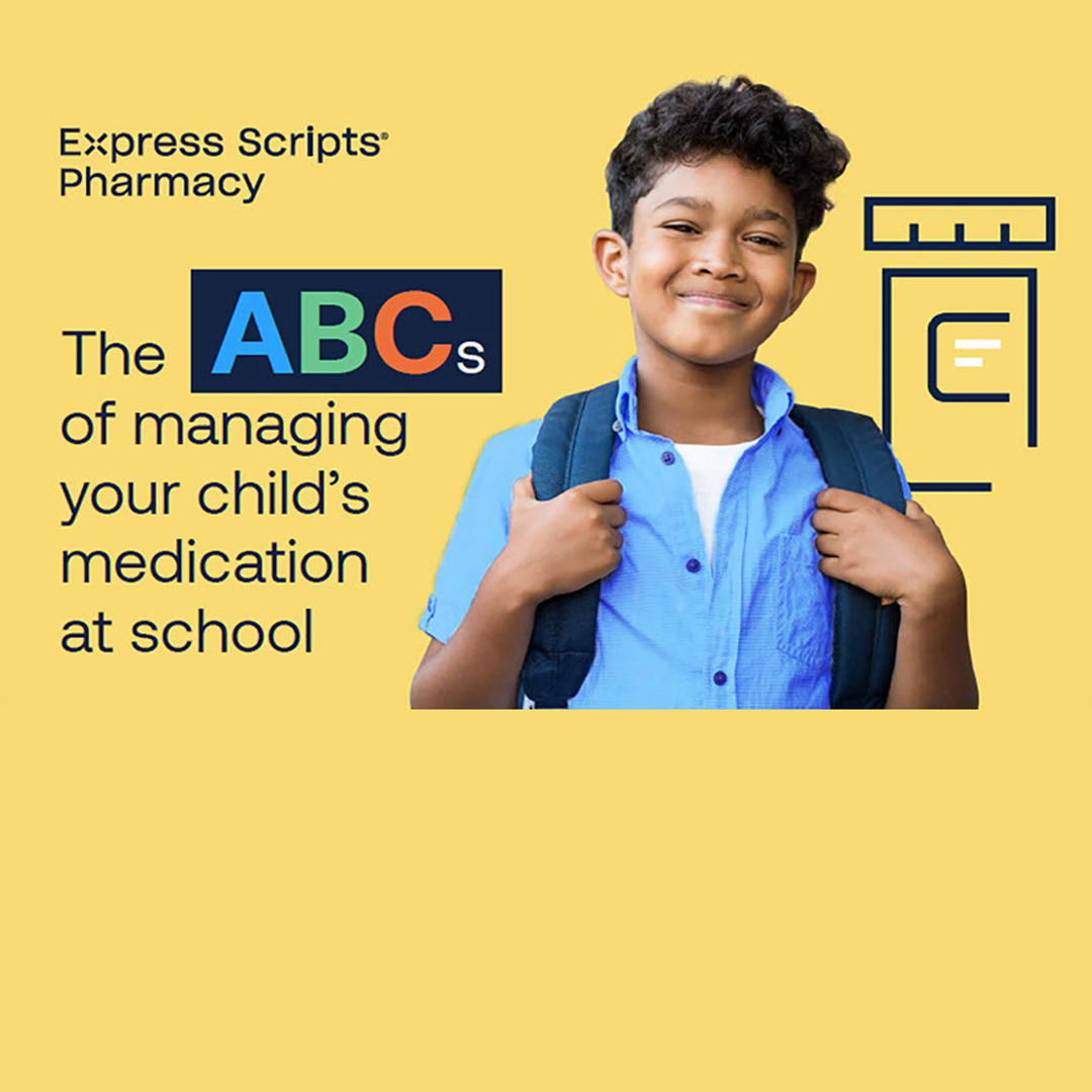 A young, school-age boy smiling.