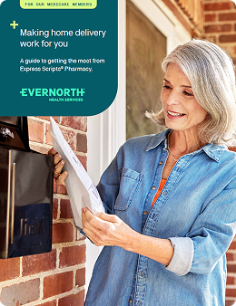 A woman collects her mail with her home delivery medication order.