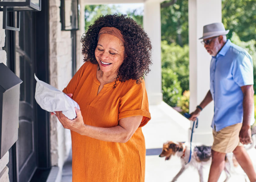 woman holds package in hands